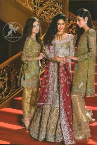 Golden brown pure tissue front-open bridal gown. This beautiful reception wear gown comes with a Brown banarsi jamawar bridal lehenga and Plachi dupatta. Golden Brown Front Open Shirt - Lehenga - Deep Red Dupatta.