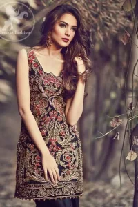 Crinkle Chiffon Short length frock features beautiful and lovely embellishments that accentuate the neckline and border on the hemline. Crinkle Chiffon Dupatta contains stones spray all over and Dangling beaded on the edges. Printed sharara with Fixed waistband with side zip closure