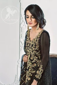 The Black semi-formal shirt features beautiful lovely embellishments on the neckline. Sequins spray scattered all over the front and back.