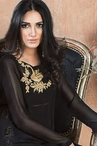 A must have creation for day to evening wear. Exhibit elegance in this black straight shirt enhanced with antique kora and dabka embroidery adorned with Swarovski crystals and zardozi. This shirt is made up of chiffon fabric and paired up with black raw silk bell bottom. This outfit is coordinated with banarsi jamawar dupatta.