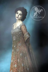 The dress features beautiful and lovely embellishments that accentuate the neckline, all over the bodice and an applique work border on the hemline. Dupatta contains an applique work border on the edges. Small ornamental spray scattered all over the dupatta.