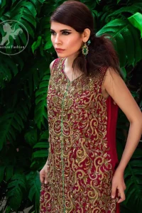 The shirt features beautiful and lovely embellishments all over the shirt. Applique work border implemented on hemline. Deep red and turquoise Crinkle chiffon and Banarsi jamawar. Sharara contains an applique work border at the bottom. Fixed waistband with side zip closure.