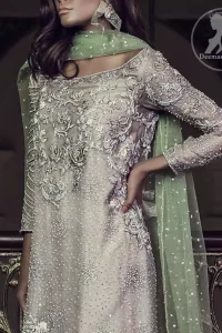 Features marvellous and awesome embellishments accent on the front. Full-length sheer Embellished sleeves and Concealed with back zip closure. Dupatta contains pearls and sequins sprayed all over.