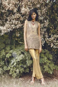 Beige and Golden Straight short shirt.has a large embroidered border implemented at the bottom of the shirt. We can add sleeves according to your requirement.