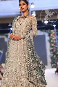 Silver Gray Bridal Frock. The frock features marvellous and awesome embellishments accenting all over the front and back Full-length sheer sleeves.