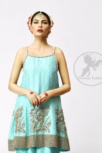 The frock has been adorned with a working border on the front and back hemline. Large embellished motifs are implemented on the front and back before the hemline.