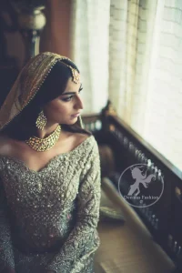 The frock has been adorned with a fully embroidered bodice. The frock features beautiful and fabulous embellishment front and back. The dress contains a working border on the hemline. Compliment with embellished waist belt. Dupatta has a four-sided embroidered border.