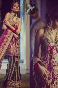 Claret colour peplum having halter neck design with bottle green loose trousers and heavy embellished Dupatta