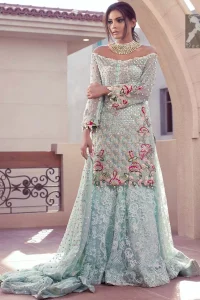 Sweetheart neckline pure crinkle chiffon shirt adorned with embellishment. Embellishment includes majorly light golden, silver, shocking pink and mehndi green shades. Shirt comes with embroidered sharara and net dupatta.