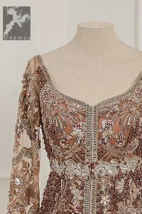 Light brown front open net maxi having brandy rose bodice. Maxi adorned with brown, light golden, champagne and silver embellishment. Pure organza dupatta adorned with embellished border.