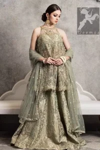 Sage net peplum having halter neck design. Peplum adorned with mix embellishment. Sage brocade plain lehenga. Sage net dupatta finished with piping and having pearls on the sides.