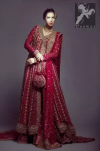 Pinkish red angrakha style bridal maxi adorned with dull golden, antique shades of embellishment. Pure banarsi jamawar chiffon fabric has been used for long length maxi. Brocade lehenga and pure banarsi chiffon jamawar dupatta.