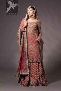 Tea rose fully embellished shirt with plum applique border on hemline. Plum dupatta adorned with tea rose and silver appliques having black finishing. Tea rose fully embellished lehenga with small motifs having plum applique border on hemline.