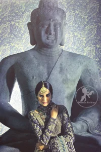 Violet Blue Blouse is of velvet fabric. It is heavy embellished full sleeves blouse featuring antique and golden shaded kora, dabka, resham, naqshi, pearls, crystals and swarovski. Blouse is fully scalloped with blue bayoux resham outline. Sleeves are adorned with floral work and sprinkling sequins/naqshi on it, while bodice having criss cross pattern all over it. It comes with raw silk lehengha which is adorned with block printing and the touch of hand embellishment. It is artistically coordinated with blue bayoux dupatta which is adorned with fully embellished appliqued borders. Borders are accompanied by delicate work along its internal sides. There are four embellished heavy flowers on corners and small floral pattern all over it.