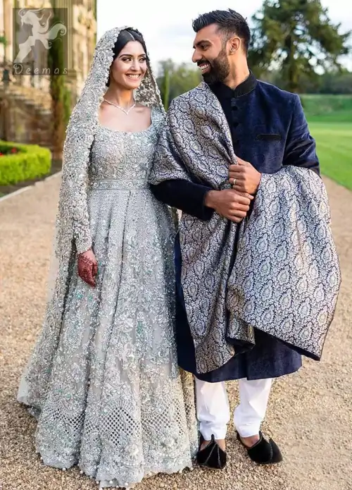 This beautiful anarkali is meticulously highlighted with silver, kora, dabka, tilla, sequins and swarovsky. This dress is beautifully sculptured with