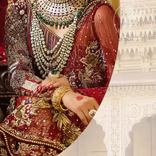 This maroon angrakha frock heavily embellished in the front with silver gold kora dabka, kundan and stones work. One side