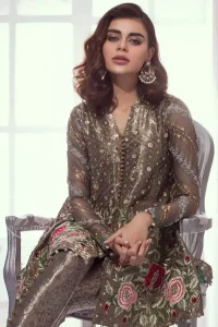 This classic dark gray peplum style back trail is meticulously highlighted with dull golden, gray, antique shaded kora, dabka, tilla, sequins and pearls.