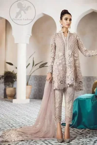 This beautiful peplum is adorned with floral embroidery. It is meticulously highlighted with silver kora, dabka, tilla, sequins, and pearls. It is further enhanced with scalloped border which adds to the look. Sleeves are fully embellished. It is artistically coordinated with embroidered pajama. It comes with chiffon dupatta which is sprinkled with sequins all over it.
