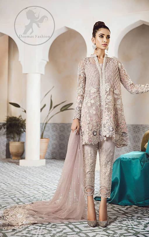 This beautiful peplum is adorned with floral embroidery. It is meticulously highlighted with silver kora, dabka, tilla, sequins, and pearls. It is further enhanced with scalloped border which adds to the look. Sleeves are fully embellished. It is artistically coordinated with embroidered pajama. It comes with chiffon dupatta which is sprinkled with sequins all over it.