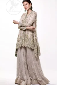 This sides-down Oyster Pink Short Frock comes with sharara which is adorned with floral motifs all over it.