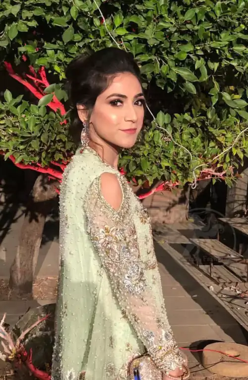 This short frok is decorated with thread, kora, dabka, tilla, sequins and swarovsky. It is embellished with floral thread embroidery.