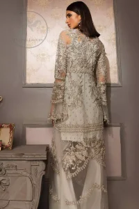 This beautiful gown is decorated with resham thread, kora, dabka, tilla, sequins and pearls. It is sculptured with floral thread embroidery. Sleeves are bell shaped and fully embroidered. It comes with brocade straight trouser. It is beautifully coordinated with organza dupatta.