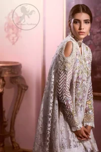 Reflecting exuberant color play in this ethereal piece meticulously highlighted with Swarovski, pearl and silver gold  kora dabka. The neckline is fully embellished with multiple color thread embroidery and floral motifs. Cold shoulder sleeves also decorated with silver gold kora dabka , tilla and thread embroidery. It comes with matching chiffon dupatta and pajama.