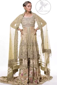 This dress is beautifully sculptured with floral embroidery. It is meticulously highlighted with antique shaded kora, dabka, tilla, sequins and pearls. It is embellished with beautiful tassels which adds to the look. It is artistically paired up with gharara which comprises of floral thread colourful motifs. It comes with chiffon dupatta which has four sided embellished borders and sprinkled with small sized sequins motifs all over it.