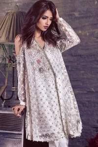 This beautiful angrakha style shirt adorned with embroidered featuring silver and antique shaded kora dabka, tilla, sequins and swarowski. Hemline is decorated with pearls. There is cold shoulder design on sleeves which adds to the look. It comes with brocade pajama.It is coordinated with net dupatta having sprinkled sequins all over it.