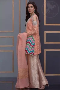 This beautiful self embroidered angrakha embellished with floral thread embroidery. This shirt is decorated with kora, tilla, dabka, swarovsky and sequins. It is allured with cold shoulder sleeves. Daaman of the shirt is decorated with different colour zik zak brocade applique which adds to the look. It is beautifully paired up with brocade trousers.It comes with organza dupatta.