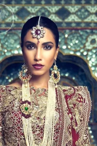 This outfit is meticulously highlighted with antique shaded kora dabka, tilla, sequins and swarovski. This dress is beautifully sculptured with floral embroidery. Shirt is fully embellished. It is artistically coordinated with embellished lehenga. Lehenga is enhanced with floral motifs and fully fully embellished with kora dabka embroidery. It comes with chiffon dupatta, having four sided embellished border and sprinkled with sequins all over it.