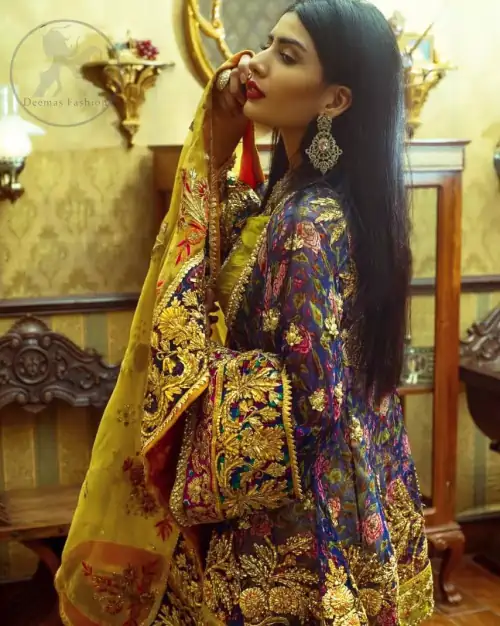 This  royal blue angrakha shirt is embellished with resham thread. It is meticulously highlighted with dull golden kora dabka, tilla, 