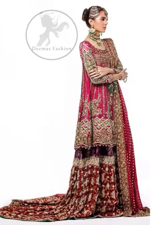 This bridal dress is adorned with floral embroidery.It is meticulously highlighted with dull golden and antique shaded kora, dabka, tilla,