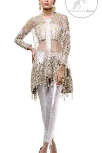 This classic outfit meticulously highlighted with silver golden kora, dabka ,tilla, sequins and pearls. This dress is beautifully sculptured with floral embroidery. The shirt is decorated with tassels and floral motifs on hemline which adds to the look. It comes with brocade pajama and beautifully decorated with net dupatta having sprinkled sequins all over it.