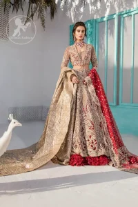 Heavy embellished bridal dress, with V Shaped blouse and skirt encrusted with swarovski stones, pearls, tilla and kora dabka along with a heavy embellished skin shawl. Beautifully paired up with deep red dupatta with sprinkled sequins and heavily embroidered borders. Best combo for a bridal.