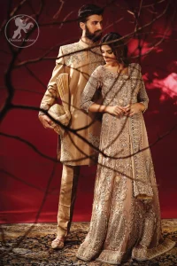 Redefine your style in this traditional and versatile ensemble ornamented with floral and geometric embroidery furnished with antique shaded kora dabka kundan and pearls. It comes with brocade cigarette pants. It is stunningly coordinated with antique brass dupatta with embellished borders on all sides and sequins spray all over.