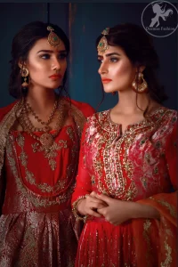 This dress is beautifully decorated with heavy embroidery. It is highlighted with kora, dabka, tilla, sequins and pearls. It comes with embroidered gharara. It is coordinated with chiffon dupatta which is sprinkled with sequins all over it. It is further furnished with four sided frilled lace.