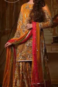 This exquisite shirt is fully decorated with floral and different motifs patterns all over it. This dress is beautifully decorated with heavy embroidery. It is highlighted with kora, dabka, tilla, sequins and pearls. Lehengha is fully embellished with tilla work. It is artistically coordinated with net dupatta which is embellished.