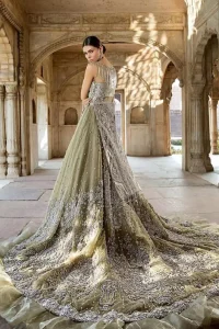 Redefine your style in this traditional and versatile ensemble ornamented with floral pattern embroidery furnished with silver shaded kora, dabka, tilla, sequins, kundan and pearls. It comes with heavily embellished lehengha, adorned with frill which adds to the look. It is stunningly coordinated with taupe gray dupatta with embellished borders on all sides and sequins spray all over it.