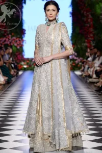 This dress is adorned with floral embroidery, highlighted with kora, dabka, tilla, sequins and pearls. It is allured with intricate embroidered motifs and delicate tassels. It is decorated with brocade applique. It comes with embellished lehengha. It is artistically coordinated with chiffon dupatta which is allured with four sided border.