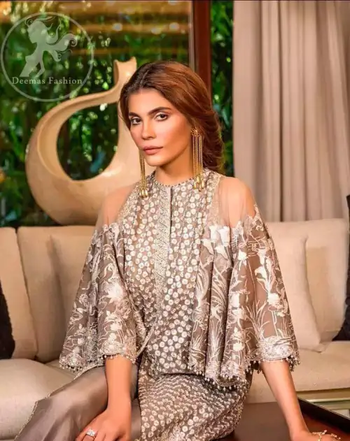 Bring out your beauty with this traditional yet modern thread embroidered gown decorated with embellished floral motif and swarovski crystals