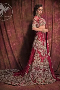 This dress is beautifully decorated with heavy embroidery. It is highlighted with dull golden kora, dabka, tilla, sequins and pearls. Fish lehengha is fully embellished.Blouse is scalloped. It comes with beautifull upper gown, sprinkled with sequins all over it. It is coordinated with chiffon dupatta which is sprinkled with sequins all over it.