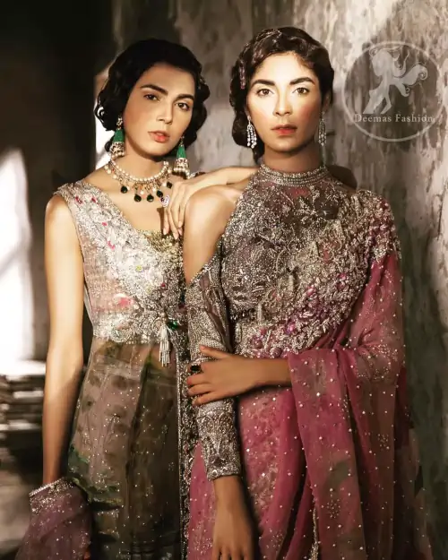 This dress is beautifully sculptured with floral embroidery. It comes with fully embroidered brocade blouse having halter neckline which adds