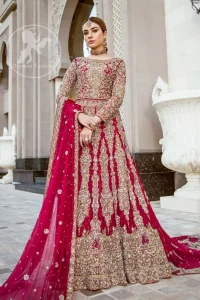 Delicately crafted and personifying chic elegance with an element of grandiose.  Heavily embellished in the front with intricate embroidered pattern done with dull golden kora, dabka, kundan, tilla and sequins. The lehnga with embroidered motifs pattern all over and finished with thick kora and dabka borders completes the look. It is coordinated with tissue dupatta which is sprinkled with sequins all over it. It is further furnished with four sided embroidered border.