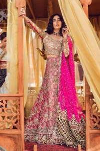 Golden full sleeves choli in kora, dabka, kundan, swarovski and stones intricately embellished. It comes with fully embellished lehengha having appliqued borders all around the hemline. Dupatta is intricately adorned with cutwork borders.It is allured with appliqued borders and delicate tassels which adds to the bling.