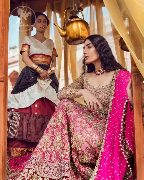 Golden full sleeves choli in kora, dabka, kundan, swarovski and stones intricately embellished. It comes with fully embellished lehengha having