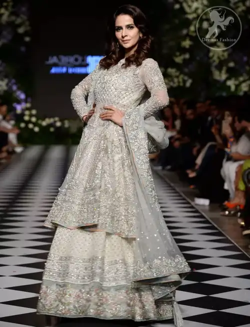 Feel glamorous in our ivory back trail frock with fascinating embellishment on neckline with silver kora, dabka, pearl and sequins.