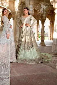 Reflecting exuberant color play in this ethereal piece meticulously highlighted with swarovski, pearl, silver kora and dabka. Heavily embellished in the front with intricate embroidered pattern and rich hemline. The sleeves are embellished with floral embroidery all over it. It comes with brocade pajama. This dress is paired with heavily embroidered organza dupatta that gives the right amount of glamour to the outfit. It is further furnished with four sided embellished border and geometric patterns.