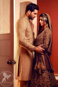 This outfit is adorned with kora, dabka, tilla, sequins and pearls. It is decorated with heavy antique shaded floral embellishments. It comes with heavy embellished lehengha  which has thick border on hemline. A magenta chiffon dupatta accompanies the garment. The dupatta has embellished borders on all four sides and small floral motifs all over it. The garment is lined with medium silk and finished with jamawar piping.