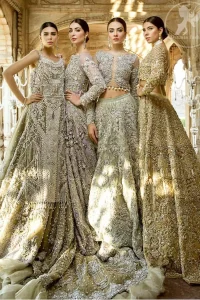 The grand gold bridal stands out due to its uniqueness and the perfect fusion of modern cut and traditional embroidery. This outfit is made of rich floral embroidery and different styles motifs which is further enhanced with zardoze work. It is highlighted with kora, dabka, tilla, sequins and pearls. Heavily embellished lehnga with embroidered motifs spread all over and finished with thick kora and dabka borders completes the look. It is coordinated with beautiful dupatta with thick matha patti border on the front and intricate beautiful border on all rest of the three sides. Furthermore it is enhanced with sprinkled sequins all over it.